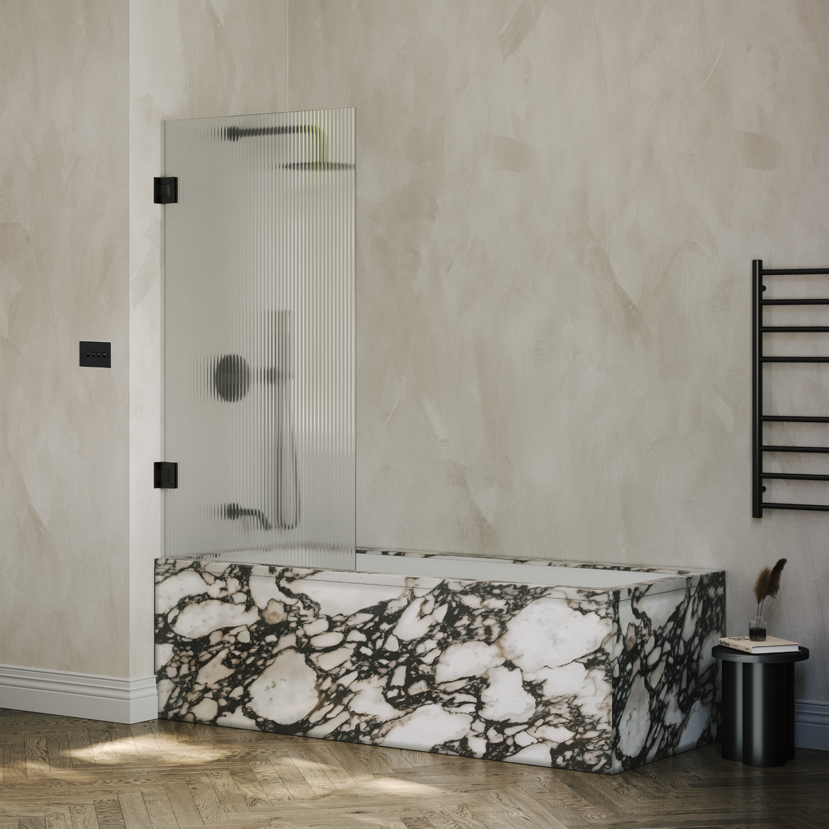 Reeded glass shower screen with matte black hinges fitted to a marble-panelled bath