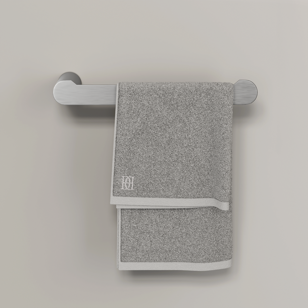 Brushed steel wall-mounted towel bar with a folded grey towel hanging over it